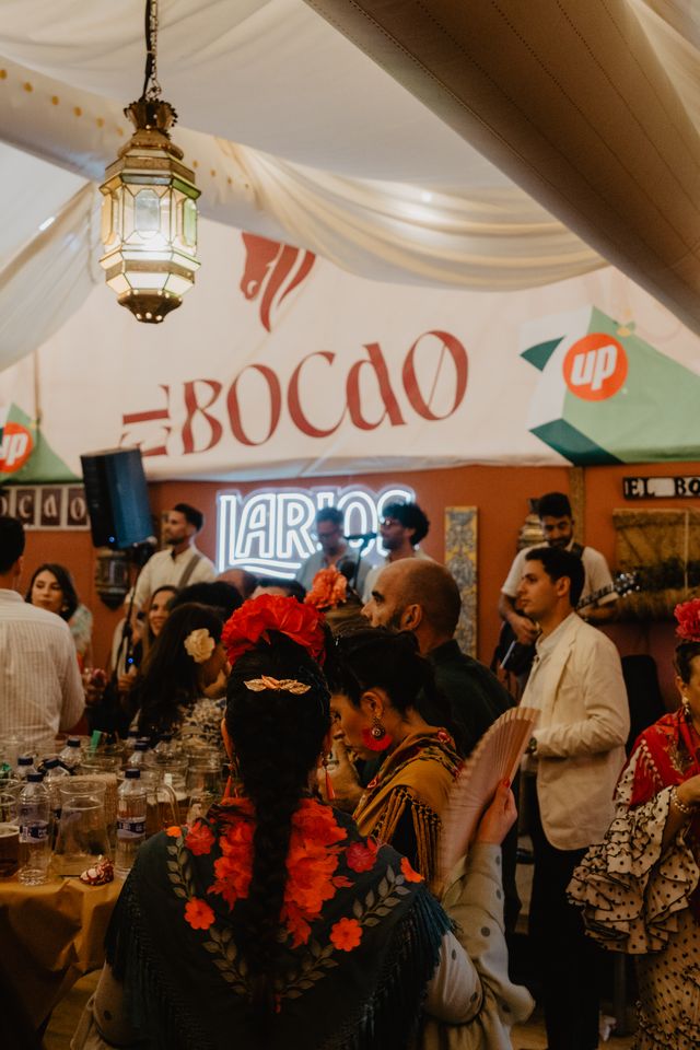 The marquee with laid tables and the “El Bocao” banner